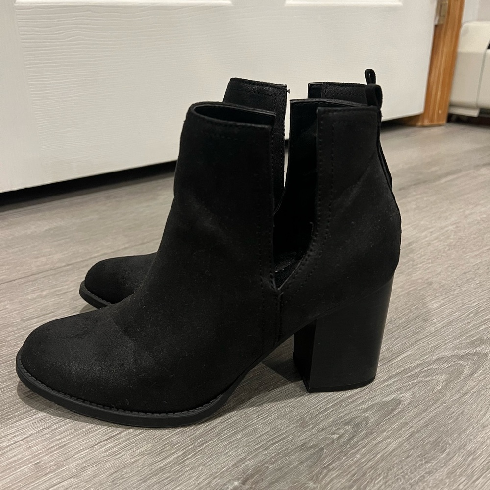 Black ankle boots with a slit